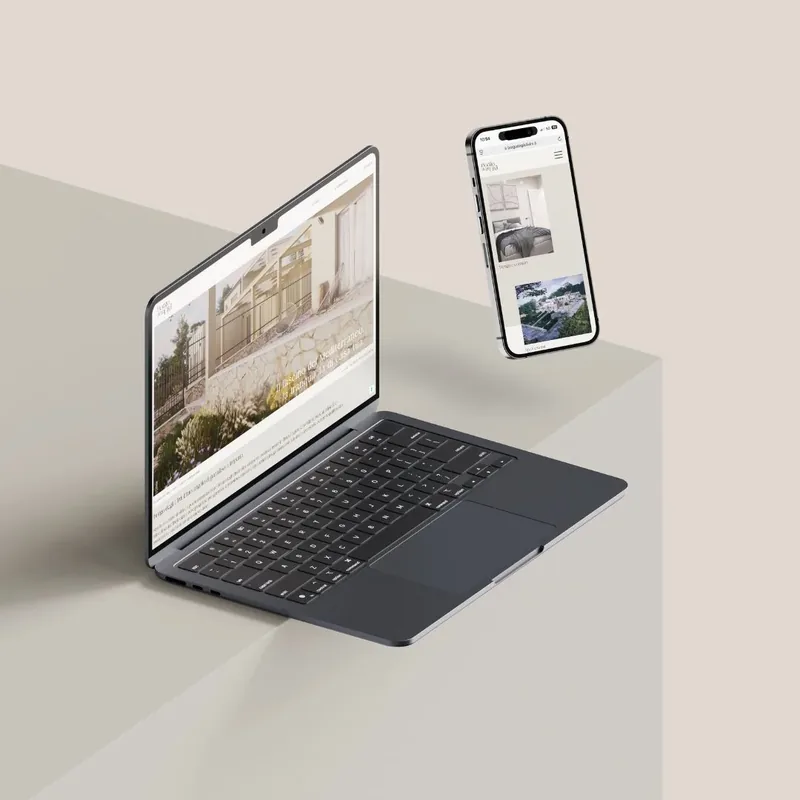 Sito web di un progetto immobiliare su portatile e telefono